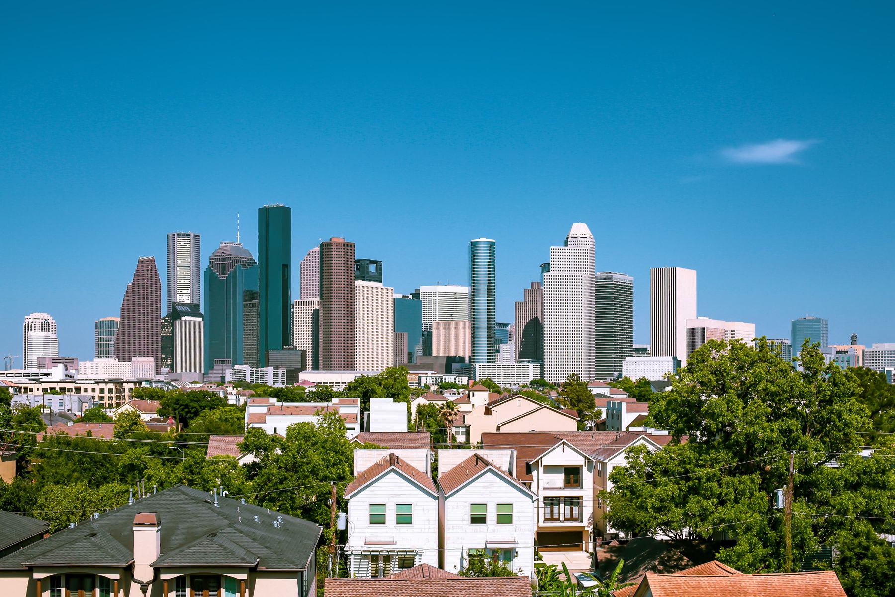 Real photograph of Houston skyline and nearby residential neighborhoods